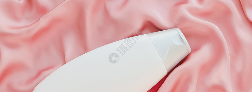 白标签化妆品容器瓶 作为粉色丝丝底的模拟产品液体肥皂奢华淋浴品牌卫生消毒剂包装管子身体图片