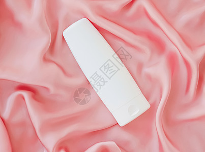白标签化妆品容器瓶 作为粉色丝丝底的模拟产品凝胶品牌浴室奢华液体身体管子淋浴小样包装背景图片