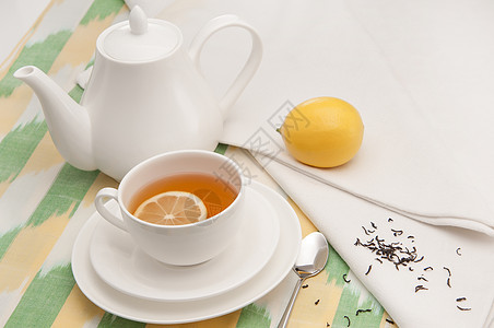 茶碟杯和餐巾纸食物时间茶杯组织制品香气白色绿色柠檬液体图片