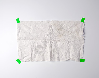 皱巴巴的脏白纸巾 粘着绿纸折痕胶水绿色广告小样皱纹海报磁带床单胶合图片