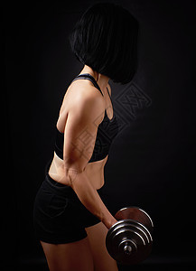 高加索年轻外貌女子的钢型装饰品达姆女士二头肌哑铃运动员女孩重量健身房身体健美训练图片