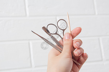 把指甲工具握在手上 针管 程序 钉子剪刀治疗团体金属成套温泉木棍保养收藏修脚图片