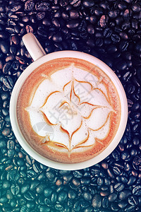 咖啡豆背景的卡普西诺艺术咖啡勺子桌子早餐午餐咖啡店拿铁食物食堂木头牛奶图片