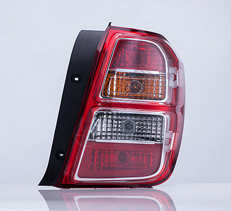 白色背景的车头灯和反光聚光灯运输玻璃反光板反射塑料机器信号红色阴影图片