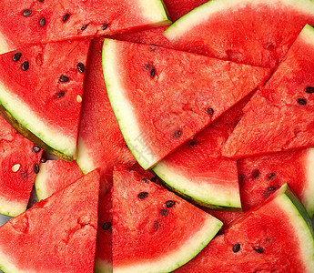 切片三边成熟的红西瓜和种子饮食甜点三角形营养小吃工作室食物水果红色图片