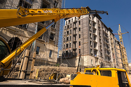 建筑机械和建筑物的建筑城市建造建筑学金属车辆装载机工程进步机器工作图片