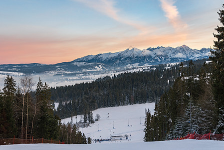 塔特拉高山冬季地貌蓝色季节岩石首脑橙子天空全景高度顶峰日落图片