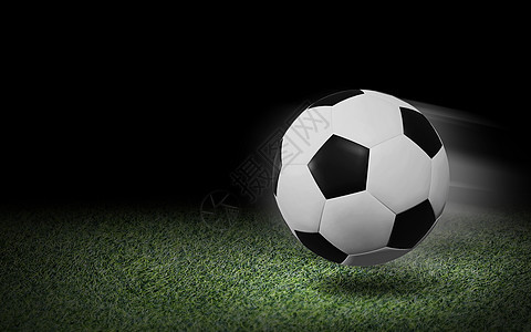绿草和黑色背景上的足球球图片