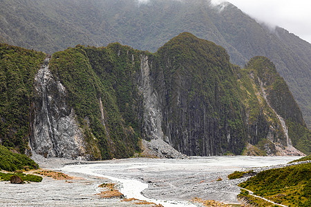 新西兰弗朗兹约瑟夫冰川河的河床旅行天气灰色风景石头植物吸引力小路岩石冰川图片