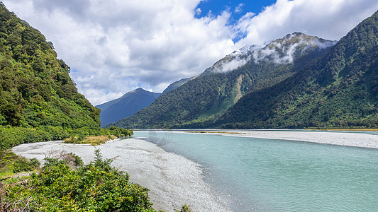 新西兰南部的河流风景图示新西兰南部乡村天空蓝色旅行棕色情绪石头天气河床国家图片