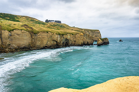 新西兰地道海滩海岸吸引力岩石支撑海岸线风景观光游客悬崖天气图片