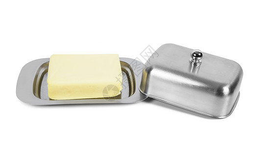 白色背景的金属盒中的黄油块美食牛奶饮食产品食物小吃养分食谱早餐烹饪图片