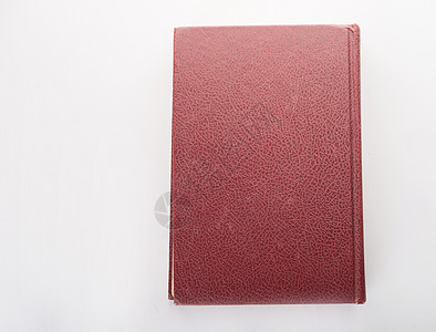 红色皮革笔记本在白色背景上被孤立图片