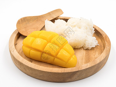 用木盘上粘着米饭的里普芒果热带饮食美食黄色白色甜点营养食物托盘水果图片