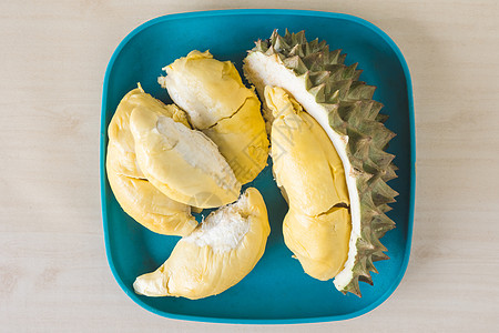 水果之王 蓝盘上的达里安最美景季节异国榴莲桌子荆棘食物营养热带情调图片