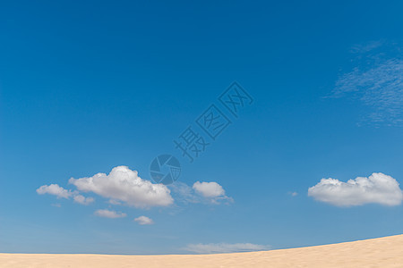 沙漠沙丘文化涟漪橙子天空场景干旱情调金子蓝色地平线图片