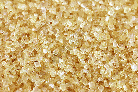 糖粉颗粒背景 糖甘蔗糖质的糖棕背景图片