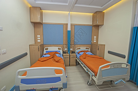 在医院病房的床铺房间毯子桌子诊所中心卧室木头装饰轮床私人图片