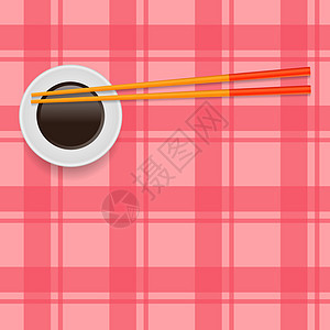 酱油和传统彩色亚洲筷子在红场背景下的食物图片