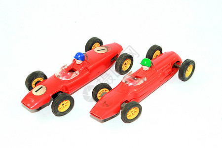 儿童玩具赛车在白落后地区玩的老式儿童玩具比赛车车轮速度车辆发动机孩子们收藏品红色跑车公式乐趣图片