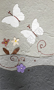 灰色背景花朵的纸机蝴蝶图片