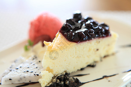 奶油芝士蓝莓芝士蛋糕片餐厅用餐水果面包脆皮蓝色美味甜点食物浆果背景