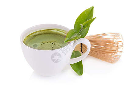 白陶瓷汤匙和绿色茶火柴拿铁饮料仪式草本植物健康食物黑色美食抹茶杯子叶子图片