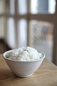 以木柴为背景的稻米饮食谷物午餐棕色白色烹饪香米粮食美食食物图片