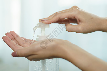 使用洗手净化剂凝胶泵喷洒器洗手的女用手液体细菌手指凝胶女性女士消毒消毒剂白色瓶子图片