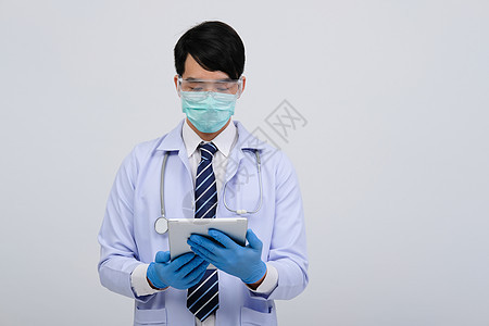 身戴甲板和石膏面罩的医生医师眼镜手套乐器专家测量医院医疗保险医疗面具卫生图片