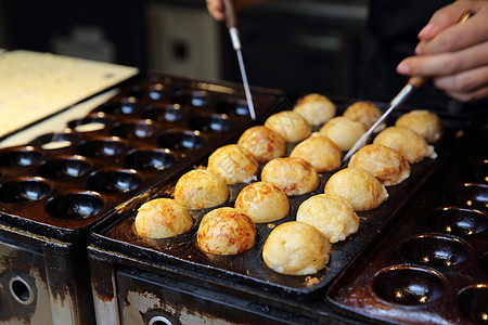 烹饪塔科亚基日本食品的过程海藻盘子食物饺子海鲜油炸薄片面粉小吃章鱼图片