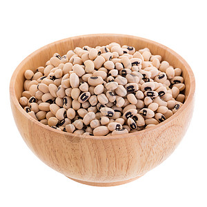 黑眼豆在一个木碗中的黑眼睛豌豆 在白色背景上被孤立食物小路糖类健康黑色营养饮食纤维剪裁豆类图片