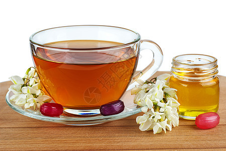 茶杯 香辣的蜂蜜和鲜花图片