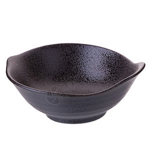 白色背景的黑陶瓷碗裂缝黏土石器陶器黑色宏观手工木头制品情调图片