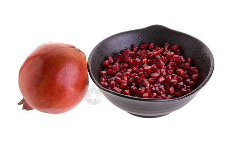 白色背景上孤立的石墨红色营养种子水果热带食物饮食宏观石榴图片