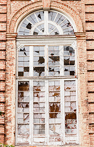 一个满是碎玻璃的大窗口背景图片