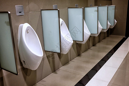 公共厕所中白色陶瓷房的紧身排图片
