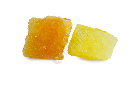 在白色背景上被孤立的晶糖岩石块块蜂蜜碳水化合物焦糖药品甘蔗蔗糖颗粒状立方体橙子图片