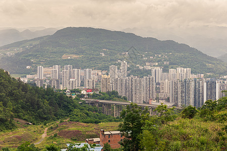 从中国重庆的武隆 美丽的乡村一面城市洞穴景观历史摩天大楼商业旅行建筑学吸引力街道图片