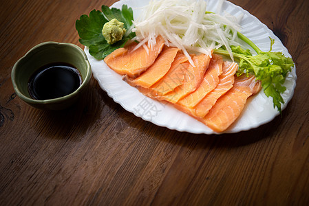 日本菜在日本餐厅吃生鱼鲑鱼饮食服务海鲜橙子自助餐武士厨房美食萝卜盘子图片