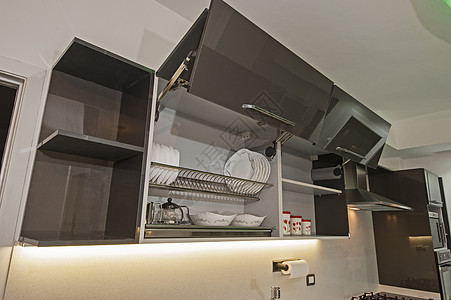 在豪华公寓的现代厨房器具展示架子家具排气扇陶器橱柜柜台设计台面背景图片