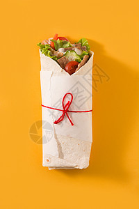 Doner kebab或沙司三明治捐赠者沙拉酸奶陀螺仪小吃蔬菜食物香料黄色洋葱图片