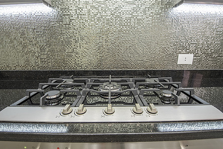 在豪华公寓的现代厨房器具家具橱柜架子风格房子炊具煤气灶旋钮装饰图片