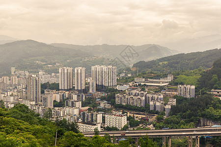 从中国重庆的武隆 美丽的乡村一面洞穴场景地标摩天大楼城市店铺街道旅游游客建筑图片