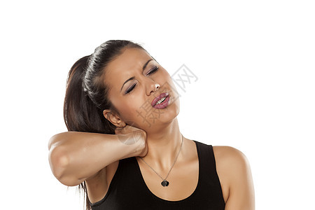 美丽的年轻美女 脖子疼的姑娘按摩工作室棕色成人疼痛痛苦肩膀黑发皮肤压力图片