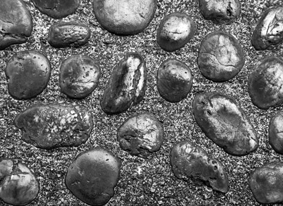 混凝土走道中河石的质地花园碎石圆形材料岩石灰色人行道鹅卵石路面卵石图片