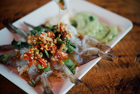 泰国海产食品市场鱼酱中的虾海鲜葫芦饮食木头冷藏生活街道辣椒蔬菜食物图片
