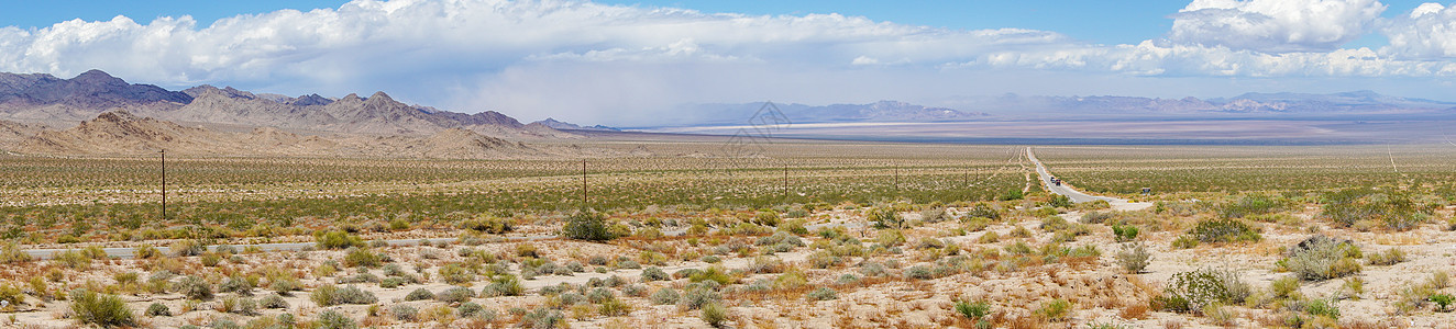 无尽的沙漠道路 冒险在沙漠中旅行旅游沥青车道地平线蓝色驾驶农村土地天空长路图片
