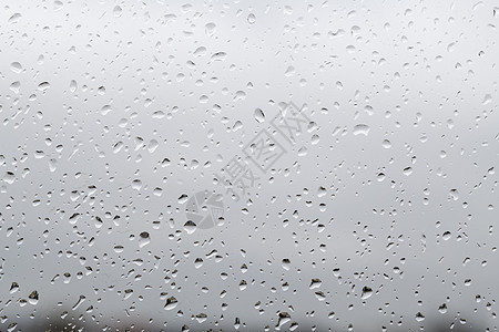下雨天的雨滴再次落在窗玻璃上图片