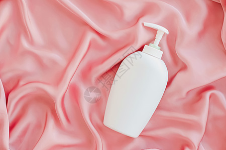 白标签化妆品容器瓶 作为粉色丝丝底的模拟产品瓶子凝胶肥皂小样洗发水皮肤保湿身体卫生液体图片